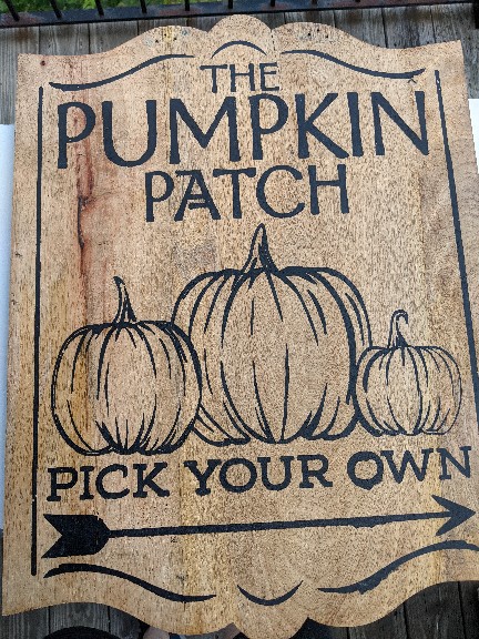 Wooden sign reads: The Pumpkin Patch Pick Your Own